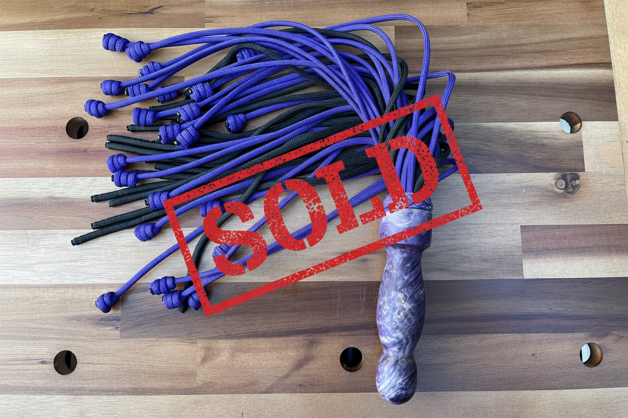 Weighted purple and black paracord flogger for BDSM and impact play