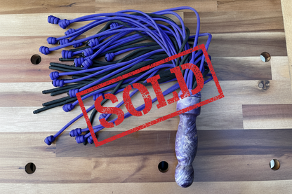 Weighted purple and black paracord flogger for BDSM and impact play