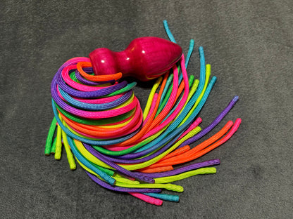 Rainbow weighted paracord flogger with pink buttplug handle