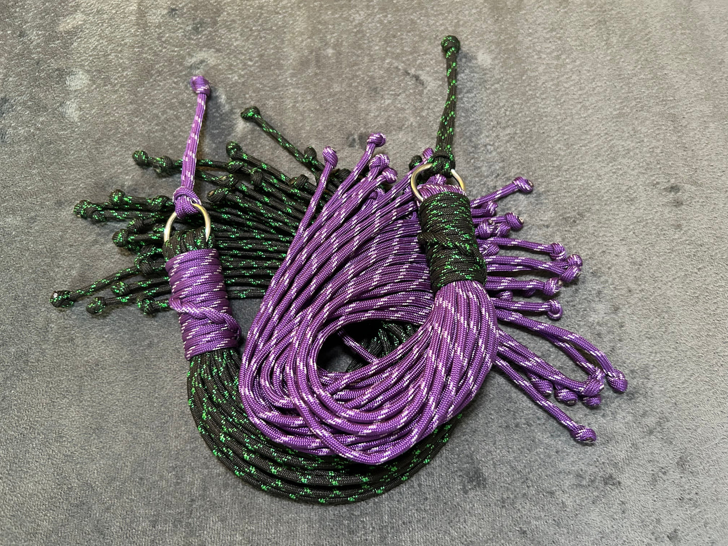 Purple and green paracord floggers for BDSM and impact play