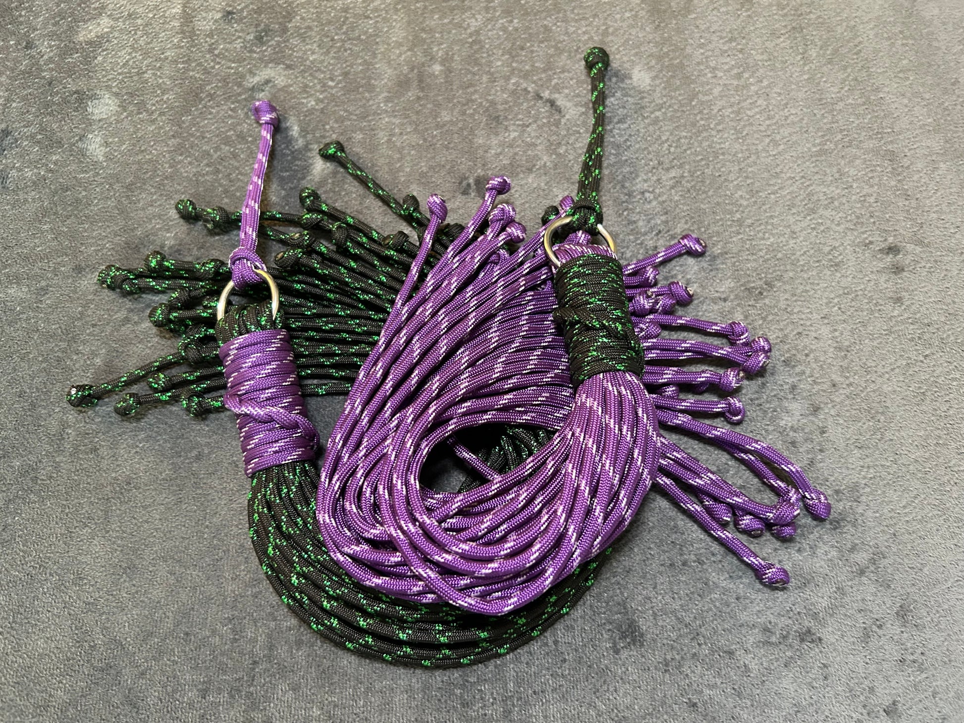 Purple and green paracord floggers for BDSM and impact play
