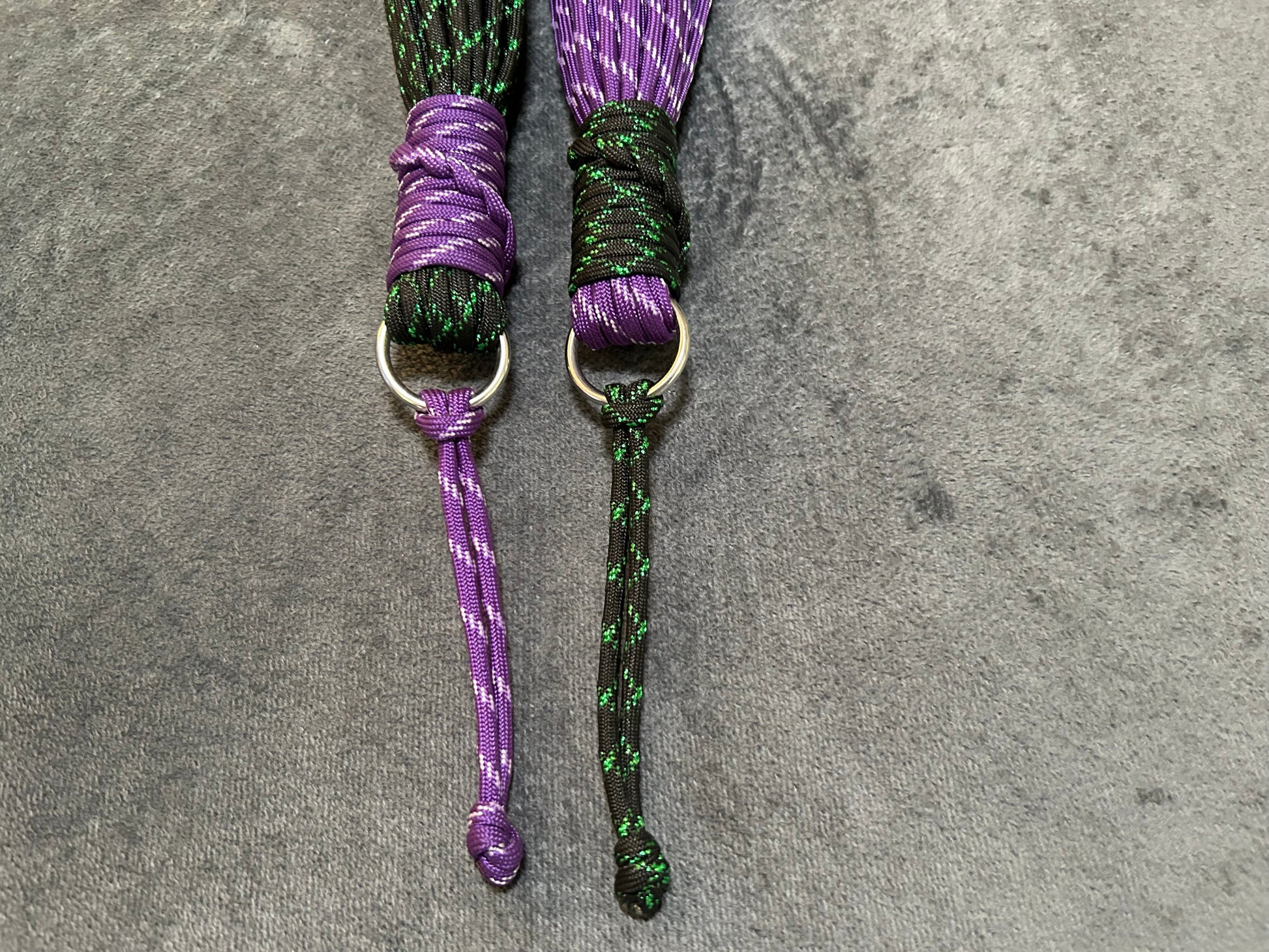 Purple and green paracord floggers for BDSM and impact play
