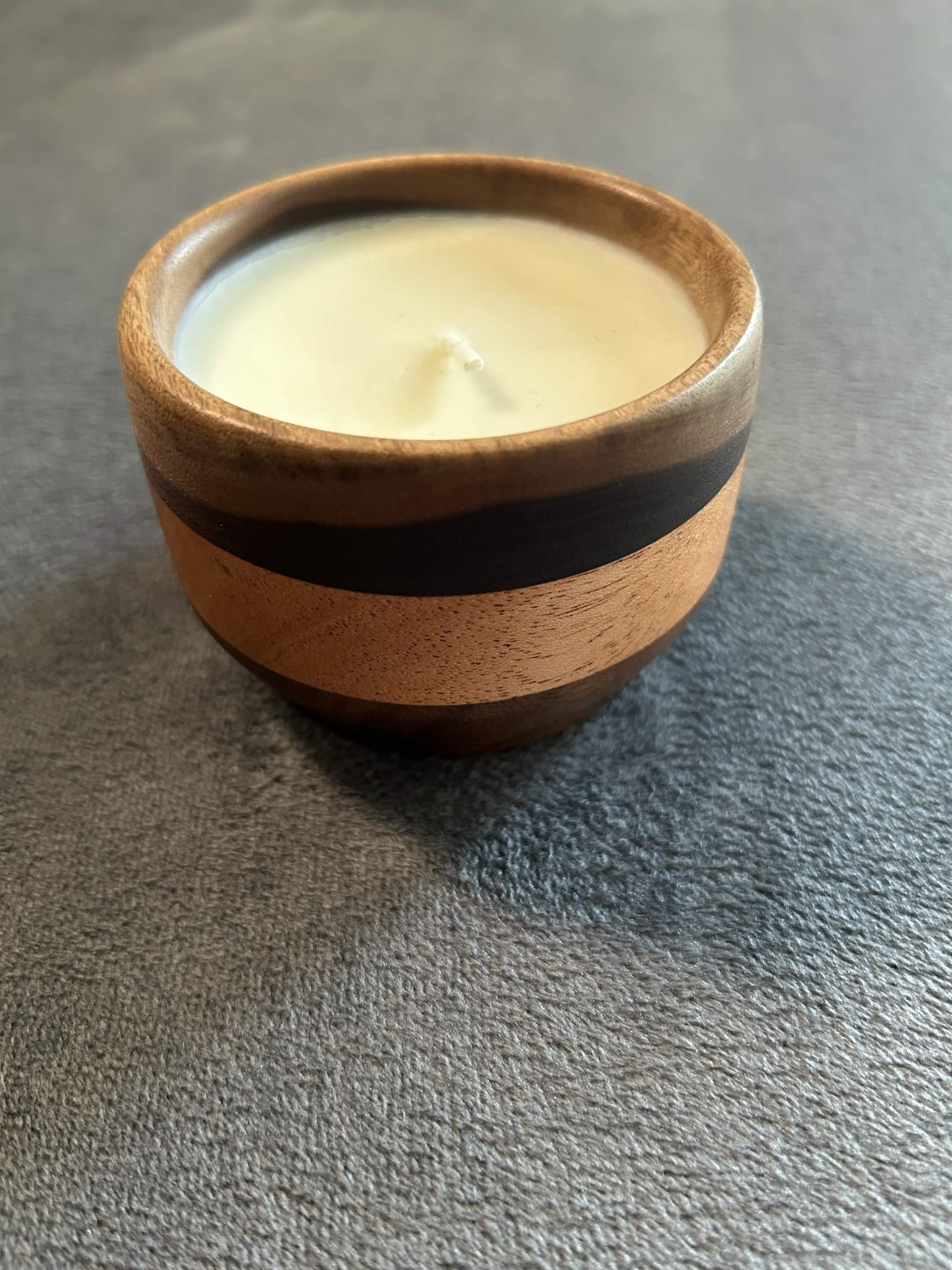 Wax play and massage candle in hardwood bowl