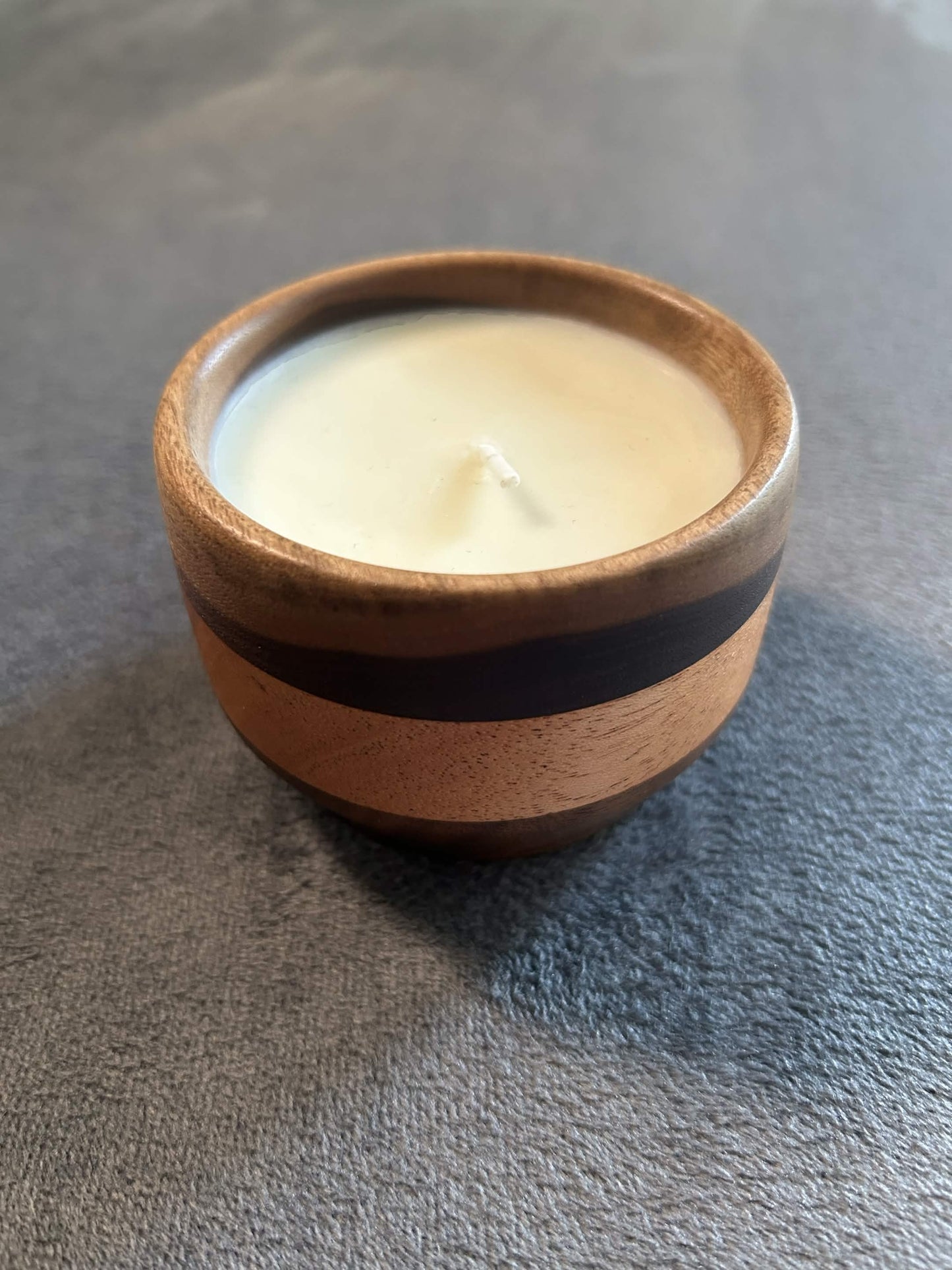 Wax play and massage candle in hardwood bowl