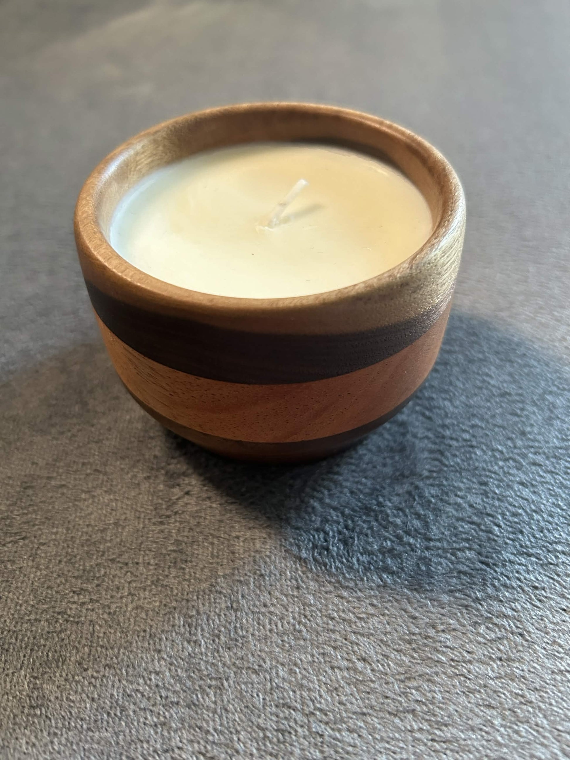 Wax play and massage candle in hardwood bowl
