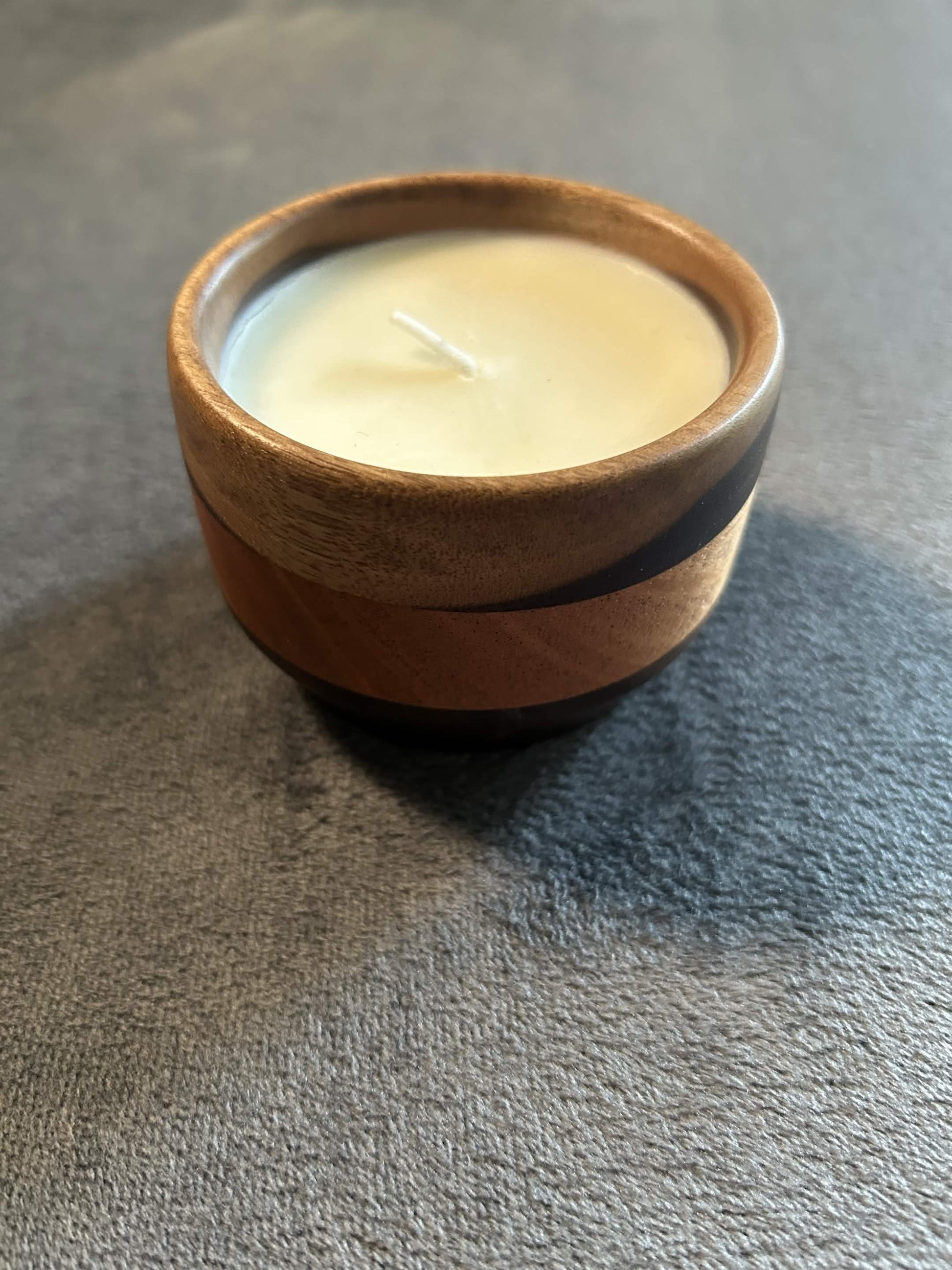 Wax play and massage candle in hardwood bowl
